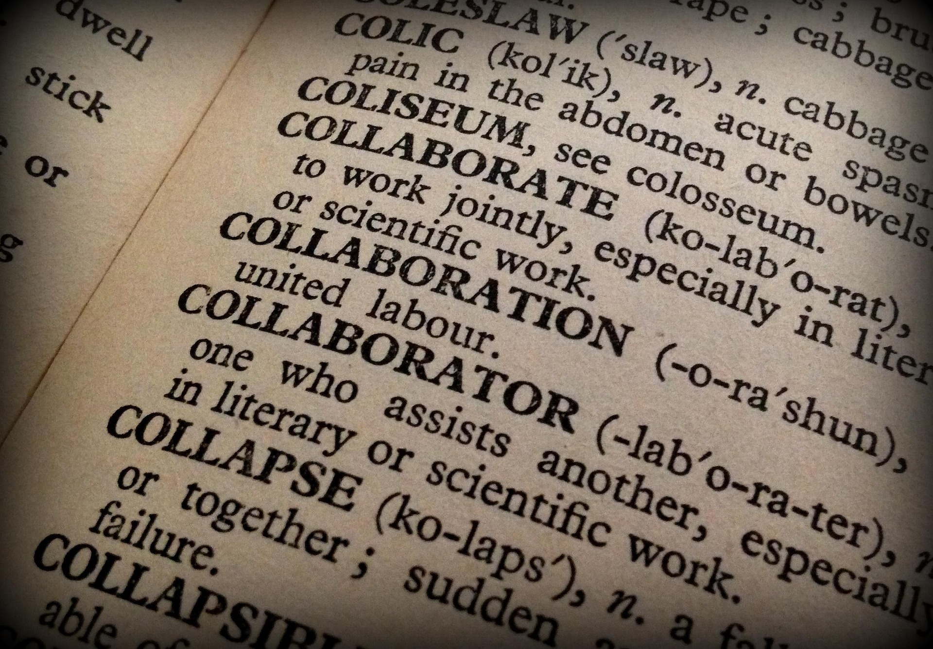 A dictionary page open at the entries for collaborate, collaboration and collaborator